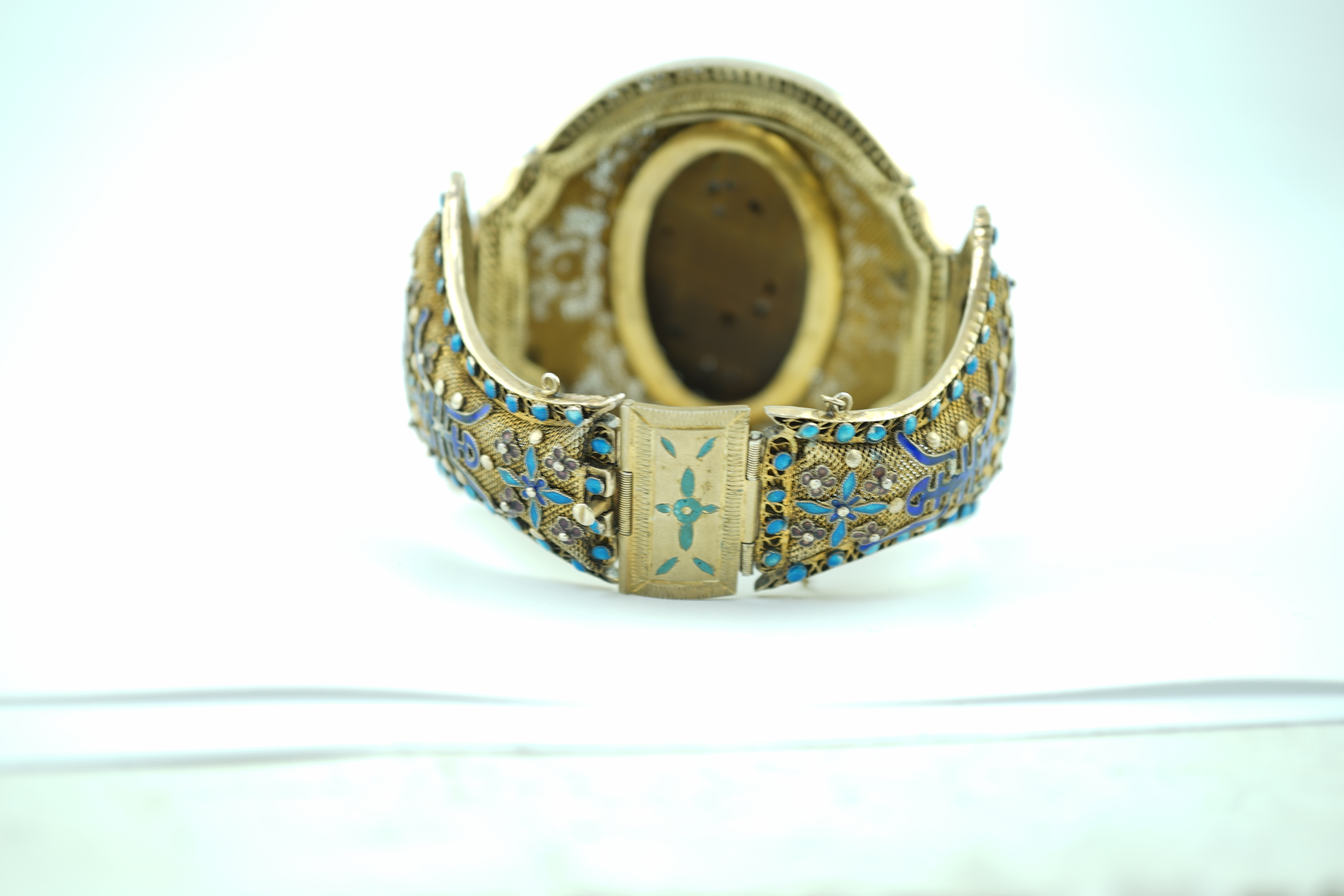 A Chinese silver-gilt, enamel and tiger's-eye bracelet, early 20th century